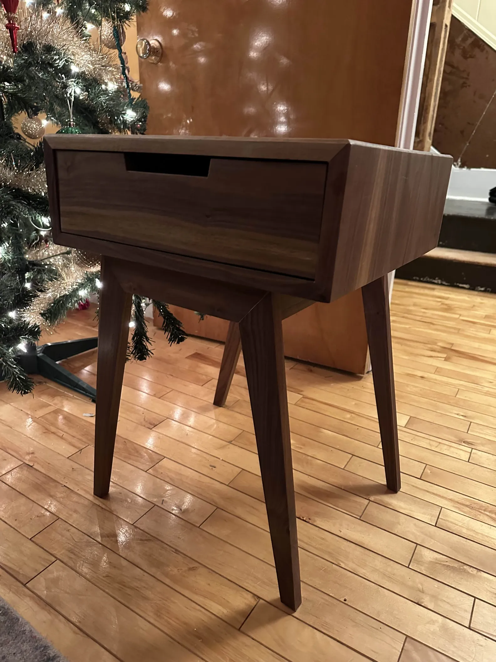A finished walnut end table